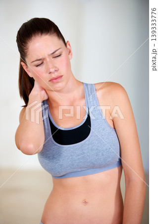 Neck pain, woman and injury with exercise, fitness or training for wellness, healthy body and health. Person, athlete and distressed, moody or unhappy with bruise, strain or overwork from workout 139333776