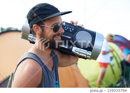 Radio, outdoor or happy man in music festival for party, event or concert with energy or listening. Rave, retro or person with smile, wellness or audio technology for techno, freedom or celebration 139333794