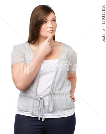 Thinking, vision and future with a plus size woman in studio isolated on a white background for planning. Idea, problem solving and brainstorming with a young body positive model looking thoughtful 139333816
