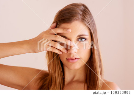 Beauty portrait, eye cover or woman with natural wellness, smooth facial cosmetics or studio skincare shine. Face makeup, self care dermatology or beautiful girl with glowing skin on beige background Beauty portrait, eye cover or woman with natural wellness, smooth facial cosmetics or studio skincare shine. Face makeup, self care dermatology or beautiful girl with glowing skin on beige background 139333995