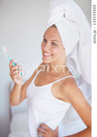 Woman, brushing teeth and smile in bathroom for hygiene healthy mouth, gum dental care or wellness. Female person, toothbrush and whitening routine for orthodontics, breath cleaning or gingivitis Woman, brushing teeth and smile in bathroom for hygiene healthy mouth, gum dental care or wellness. Female person, toothbrush and whitening routine for orthodontics, breath cleaning or gingivitis 139334089