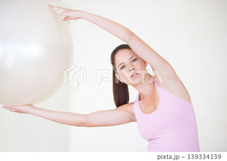 Portrait, fitness and woman with exercise, ball and stretching with wellness, self care and healthy body. Face, person or girl with equipment, activity or workout with mobility, balance or training Portrait, fitness and woman with exercise, ball and stretching with wellness, self care and healthy body. Face, person or girl with equipment, activity or workout with mobility, balance or training 139334139