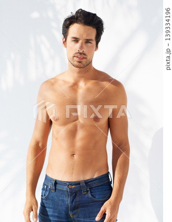 Portrait, man and shirtless with confidence with fashion mock up on white background in Greece. Male model, face and serious expression with person for cool, trendy and modern style with jeans Portrait, man and shirtless with confidence with fashion mock up on white background in Greece. Male model, face and serious expression with person for cool, trendy and modern style with jeans 139334196