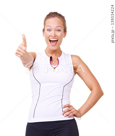 Fitness winner, thumbs up and woman in studio for training success, workout achievement and health goals or like emoji. Portrait of sports model with yes, wow and happy results on a white background Fitness winner, thumbs up and woman in studio for training success, workout achievement and health goals or like emoji. Portrait of sports model with yes, wow and happy results on a white background 139334224
