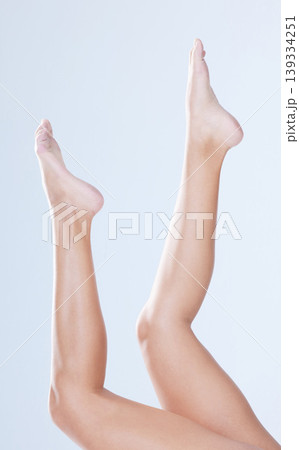 Body care, woman and legs in studio for depilation, hair removal and cosmetology for wellness and laser. Person, epilation and shaving routine for cosmetic, skincare and waxing on white background Body care, woman and legs in studio for depilation, hair removal and cosmetology for wellness and laser. Person, epilation and shaving routine for cosmetic, skincare and waxing on white background 139334251