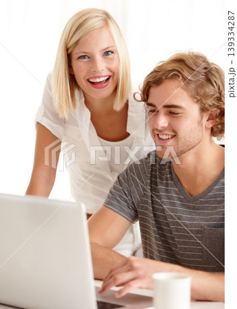 Laptop, smile and ecommerce with a young couple in their apartment for accounting or budget planning together. Computer, bank or finance with a happy man and woman in their home for investment growth 139334287