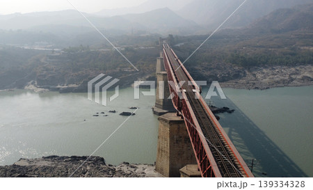 Attock railway track over indus bridge with misty water below pakistan 139334328