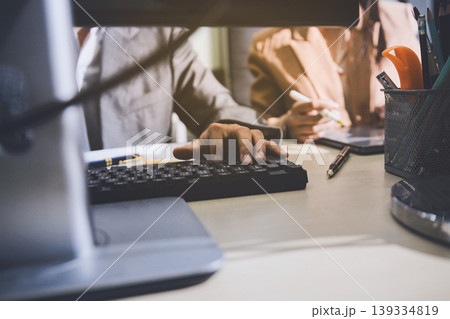 Accounting company provide finance and taxation planning for profitable cash flow, Auditor accountant working in office, analyze financial data and accounting record with calculator Accounting company provide finance and taxation planning for profitable cash flow, Auditor accountant working in office, analyze financial data and accounting record with calculator 139334819