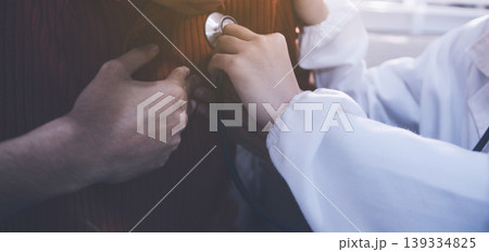 Doctor using a stethoscope checking patient with examining, presenting results symptom and recommend treatment method, Healthcare and medical concept Doctor using a stethoscope checking patient with examining, presenting results symptom and recommend treatment method, Healthcare and medical concept 139334825