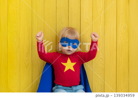 Little boy dressed as a superhero having fun at home Little boy dressed as a superhero having fun at home 139334959