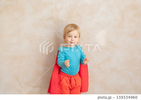 Little boy dressed as a superhero having fun at home Little boy dressed as a superhero having fun at home 139334960