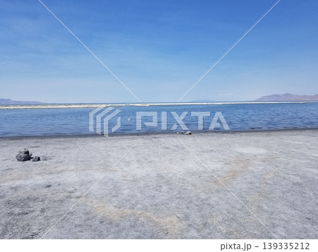 Expansive view of the Great Salt Lake shoreline under a bright blue sky. Expansive view of the Great Salt Lake shoreline under a bright blue sky. 139335212