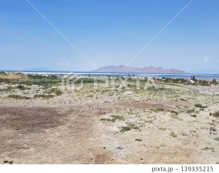 Expansive view of the Great Salt Lake shoreline under a bright blue sky. Expansive view of the Great Salt Lake shoreline under a bright blue sky. 139335215