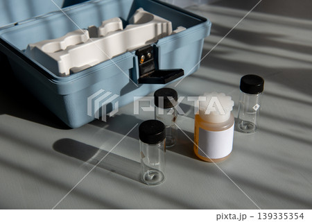 Portable water testing kit with sample vials and container Portable water testing kit with sample vials and container 139335354