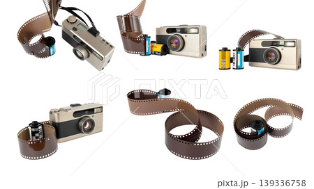 retro film camera with rolls of developed photographic film on white background retro film camera with rolls of developed photographic film on white background 139336758