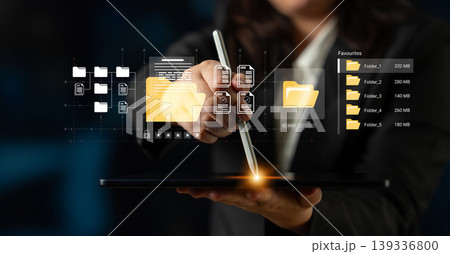 Businessperson Using Digital Tablet to Organize Virtual Files and Folders with Touchscreen Pen in Modern Office Environment Ledger Businessperson Using Digital Tablet to Organize Virtual Files and Folders with Touchscreen Pen in Modern Office Environment Ledger 139336800