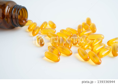 Fish oil or Cod liver oil gel in capsules with omega 3 vitamins, supplementary healthy food. Fish oil or Cod liver oil gel in capsules with omega 3 vitamins, supplementary healthy food. 139336944