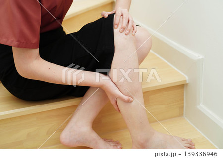Asian lady fall down the stairs and pain at hip and waist because slippery surfaces. Asian lady fall down the stairs and pain at hip and waist because slippery surfaces. 139336946