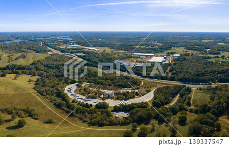 Aerial view of truck stop rest area near busy American interstate freeway. Recreational place during delivering cargo. Aerial view of truck stop rest area near busy American interstate freeway. Recreational place during delivering cargo. 139337547