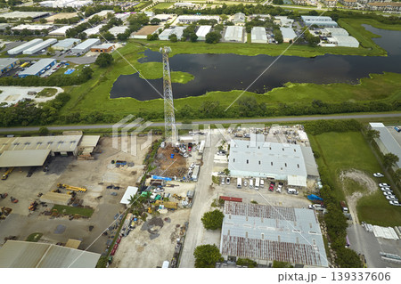 Aerial view of industrial park with goods warehouses and logistics centers in city zone from above Aerial view of industrial park with goods warehouses and logistics centers in city zone from above 139337606