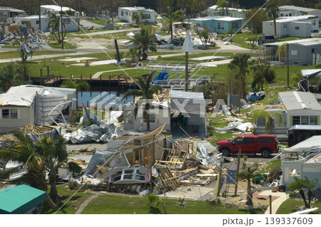 Aerial view of heavily damaged by hurricane Ian houses in Florida mobile home residential area. Consequences of natural disaster 139337609