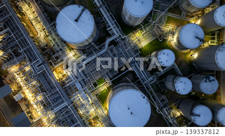 Aerial view oil storage tank and pipeline steel at night, Oil tank storage chemical petroleum petrochemical refinery product, Oil transportation system pipeline steel at oil refinery industry 139337812