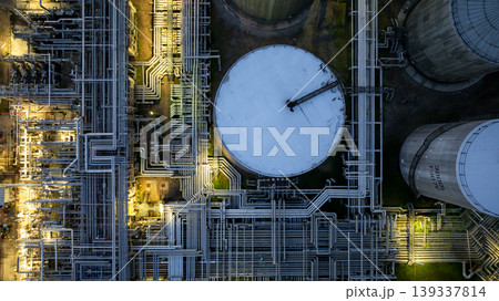 Aerial view oil storage tank and pipeline steel at night, Oil tank storage chemical petroleum petrochemical refinery product, Oil transportation system pipeline steel at oil refinery industry 139337814