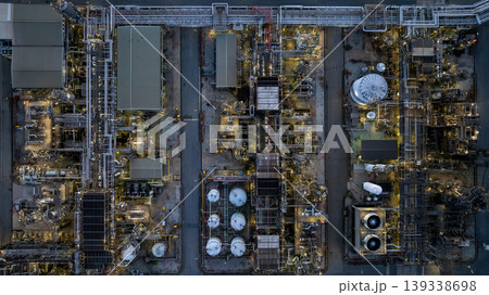 Aerial view Oil and Gas refinery industrial at night, Oil and Gas refinery plant form industry, Refinery plant factory white oil storage tank at night, Oil and Gas refinery plant from industry zone. Aerial view Oil and Gas refinery industrial at night, Oil and Gas refinery plant form industry, Refinery plant factory white oil storage tank at night, Oil and Gas refinery plant from industry zone. 139338698
