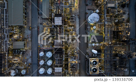 Aerial view Oil and Gas refinery industrial at night, Oil and Gas refinery plant form industry, Refinery plant factory white oil storage tank at night, Oil and Gas refinery plant from industry zone. 139338700