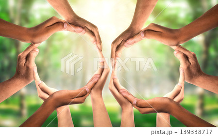 Symbol and shape of circle created from hands. Group Unity and diversity partnership as hands connected together as two teams in support as a symbol of connected teamwork and togetherness. Symbol and shape of circle created from hands. Group Unity and diversity partnership as hands connected together as two teams in support as a symbol of connected teamwork and togetherness. 139338717