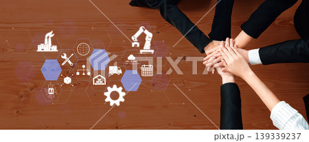 Team Collaboration and Innovation in Business with Hands Together Over Industrial Icons for Concept of Partnership and Strategy Development Fluxor Team Collaboration and Innovation in Business with Hands Together Over Industrial Icons for Concept of Partnership and Strategy Development Fluxor 139339237