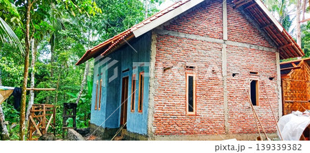 Red brick house with blue walls Red brick house with blue walls 139339382