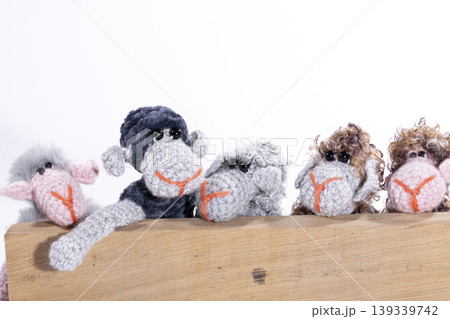 Crocheted sheeps toy on a white background Crocheted sheeps toy on a white background 139339742