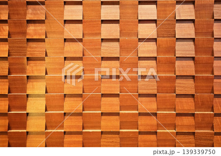 Decorative Geometric Wooden Wall Panel with Repeating Pattern of Angled Blocks. 139339750