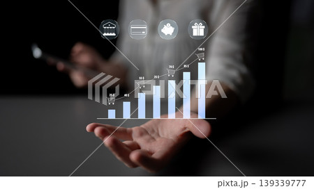 Business Growth Chart with Digital Icons Illustrating Financial Progress on Smartphone in Professional Setting Quark Business Growth Chart with Digital Icons Illustrating Financial Progress on Smartphone in Professional Setting Quark 139339777