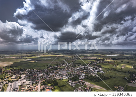 Aerial View of Stormy Clouds Over a Northern Italian Village 139340365