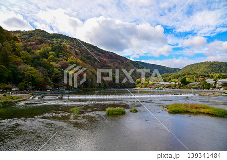 The view of Katsura River at autumn from Togetsukyo Bridge, Kyoto, Japan. A well-known place of scenic beauty in the western hills of Kyoto. Nature and travel concept. 139341484