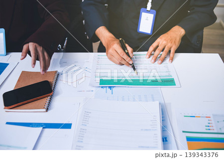 Accounting company provide finance and taxation planning for profitable cash flow, Auditor and accountant team working in office, analyze financial data and accounting record with calculator Accounting company provide finance and taxation planning for profitable cash flow, Auditor and accountant team working in office, analyze financial data and accounting record with calculator 139343376