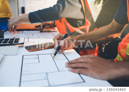 Concept Architect and desk of Architectural project in construction site or office building with mining light Concept Architect and desk of Architectural project in construction site or office building with mining light 139343403