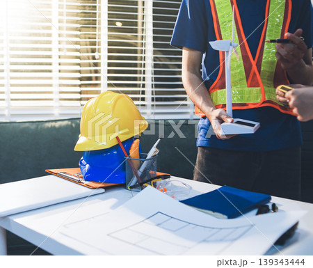 Concept Architect and desk of Architectural project in construction site or office building with mining light Concept Architect and desk of Architectural project in construction site or office building with mining light 139343444