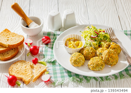 Baked meat and vegetable polpette with salad Baked meat and vegetable polpette with salad 139343494