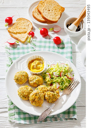 Baked meat and vegetable polpette with salad Baked meat and vegetable polpette with salad 139343495