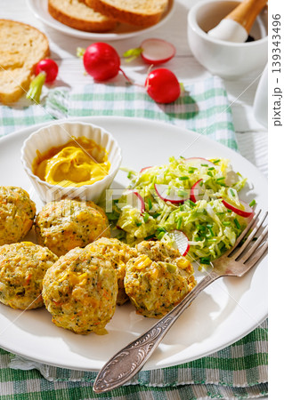 Baked meat and vegetable polpette with salad 139343496