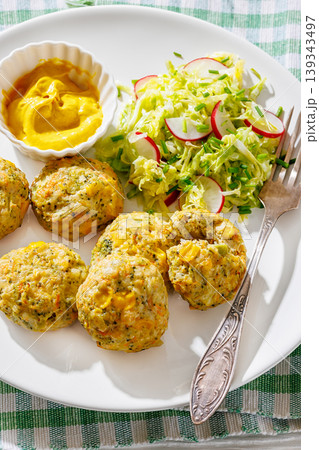 Baked meat and vegetable polpette with salad 139343497