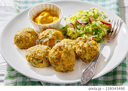 Baked meat and vegetable polpette with salad 139343498