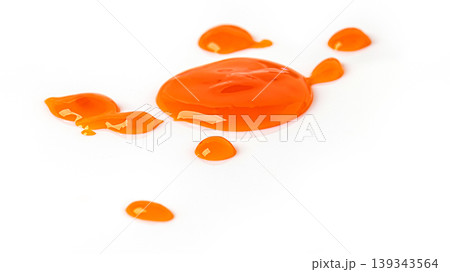 Orange liquid droplets splashing on white background 139343564