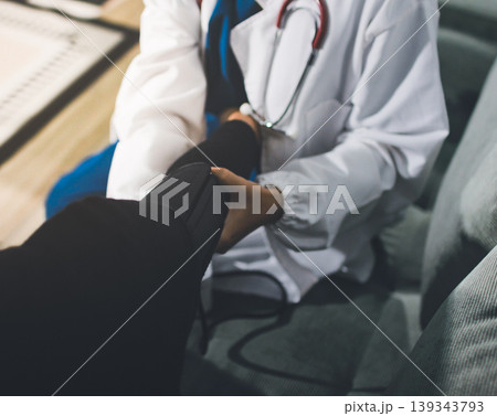 Pregnant woman having her belly examined by a doctor with a stethoscope in a clinic room highlighting a medical checkup, pregnancy health, and prenatal care Pregnant woman having her belly examined by a doctor with a stethoscope in a clinic room highlighting a medical checkup, pregnancy health, and prenatal care 139343793