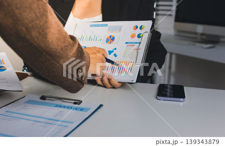 Accountants processing financial documents and taxes, managing corporate finance in a modern office. Audit and taxes in business 139343879