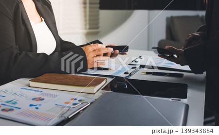 Accountants processing financial documents and taxes, managing corporate finance in a modern office. Audit and taxes in business 139343884
