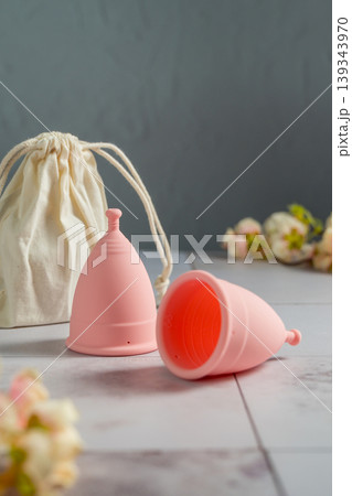 Menstrual cups. Pink feminine hygiene product. Women health concept. Menstrual cups. Pink feminine hygiene product. Women health concept. 139343970